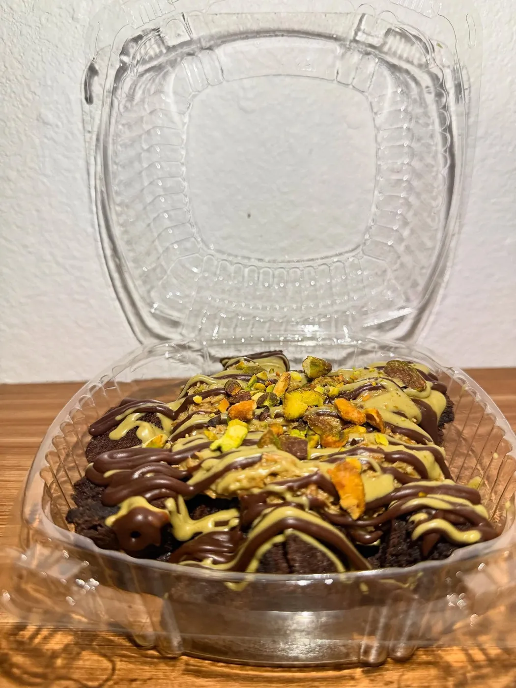 Brownies drizzled with chocolate and pistachio cream